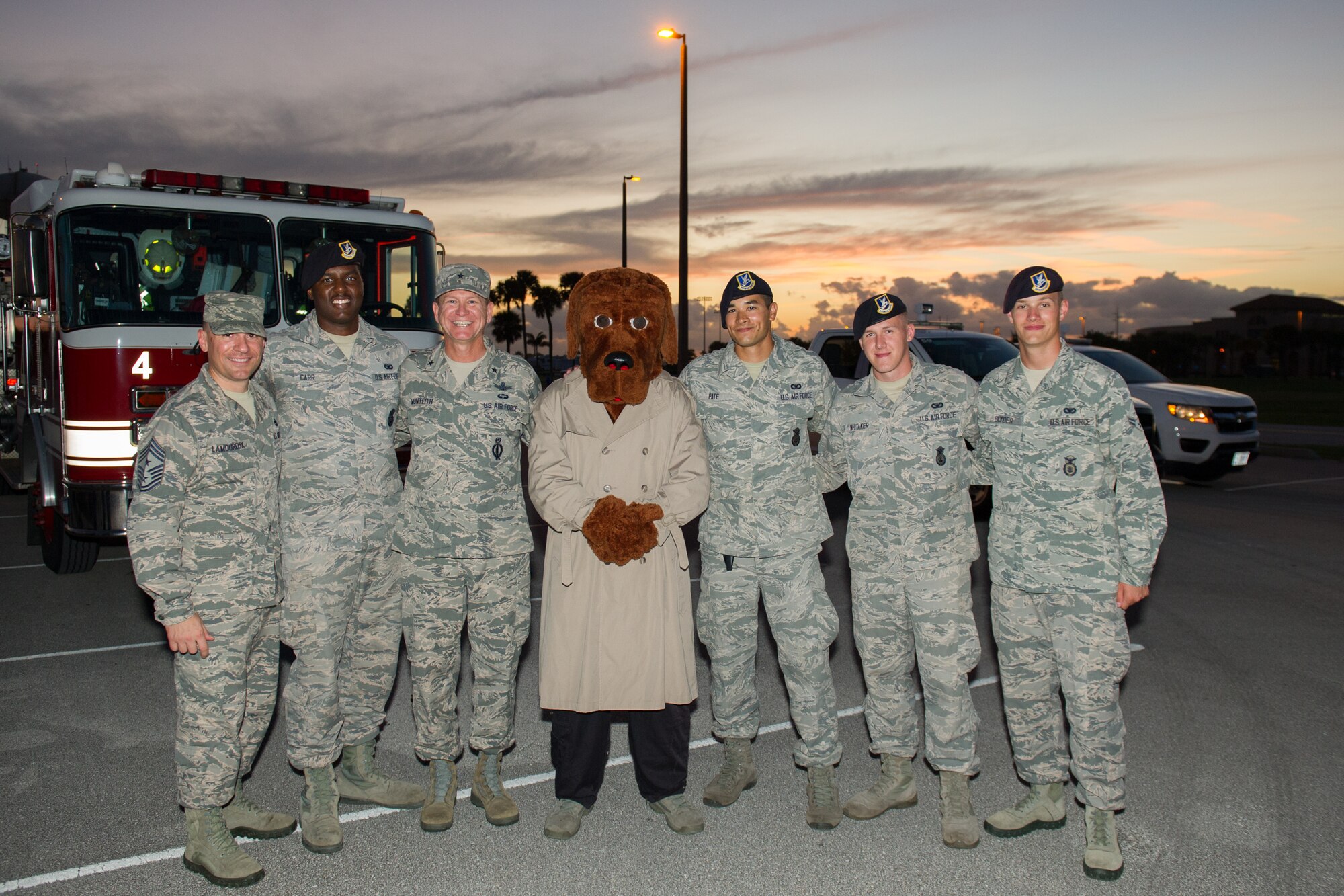 Members of the 45th Space Wing and its mission partners participate in the Holiday Parade, as residents line the sidewalks to witness the event, Dec. 17, 2015, at Patrick Air Force Base, Fla. Fire trucks from Patrick AFB drove around base with Santa, Mrs. Claus, and Sparky the Dog, and greeted residents with handfuls of candy and holiday cheer. (U.S. Air Force photo by Benjamin Thacker) (Released) 