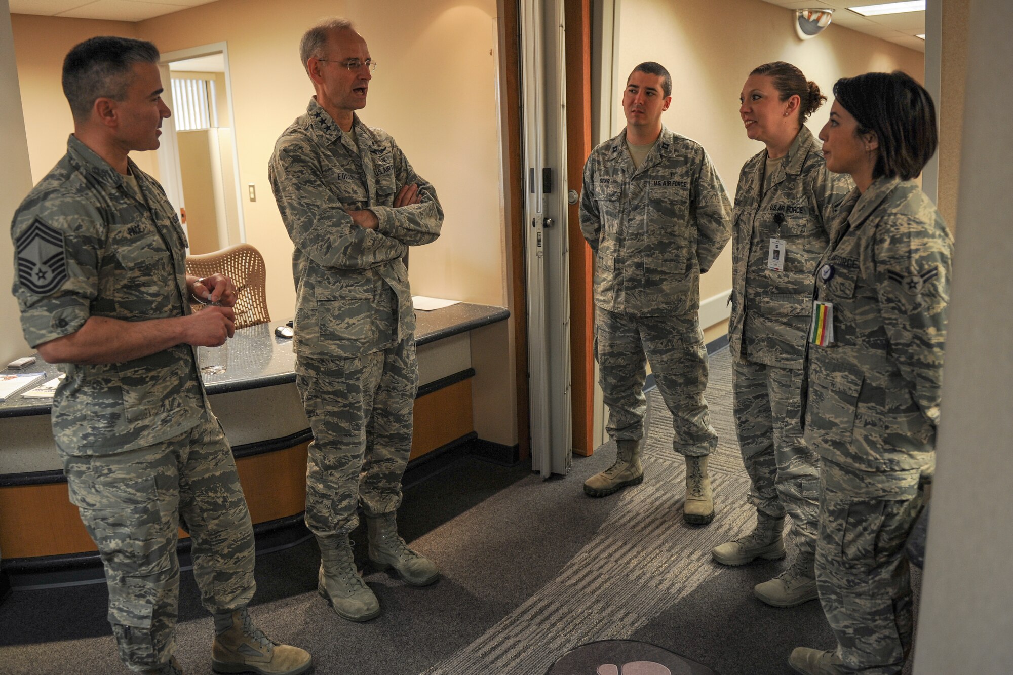 Airmen from the 19th Aerospace Medicine Squadron public health flight brief U.S Air Force Surgeon General Lt. Gen. Mark Ediger, center, and Chief Master Sgt. Jason Pace, Medical Enlisted Force chief, Dec. 16, 2015, at Little Rock Air Force Base, Ark. The 19th AMDS Public Health flight conducts entomology tests, pregnancy interviews, health and sanitation inspections, hearing tests, patient education programs, tracking and patient interviews. (U.S. Air Force photo/Senior Airman Harry Brexel) 