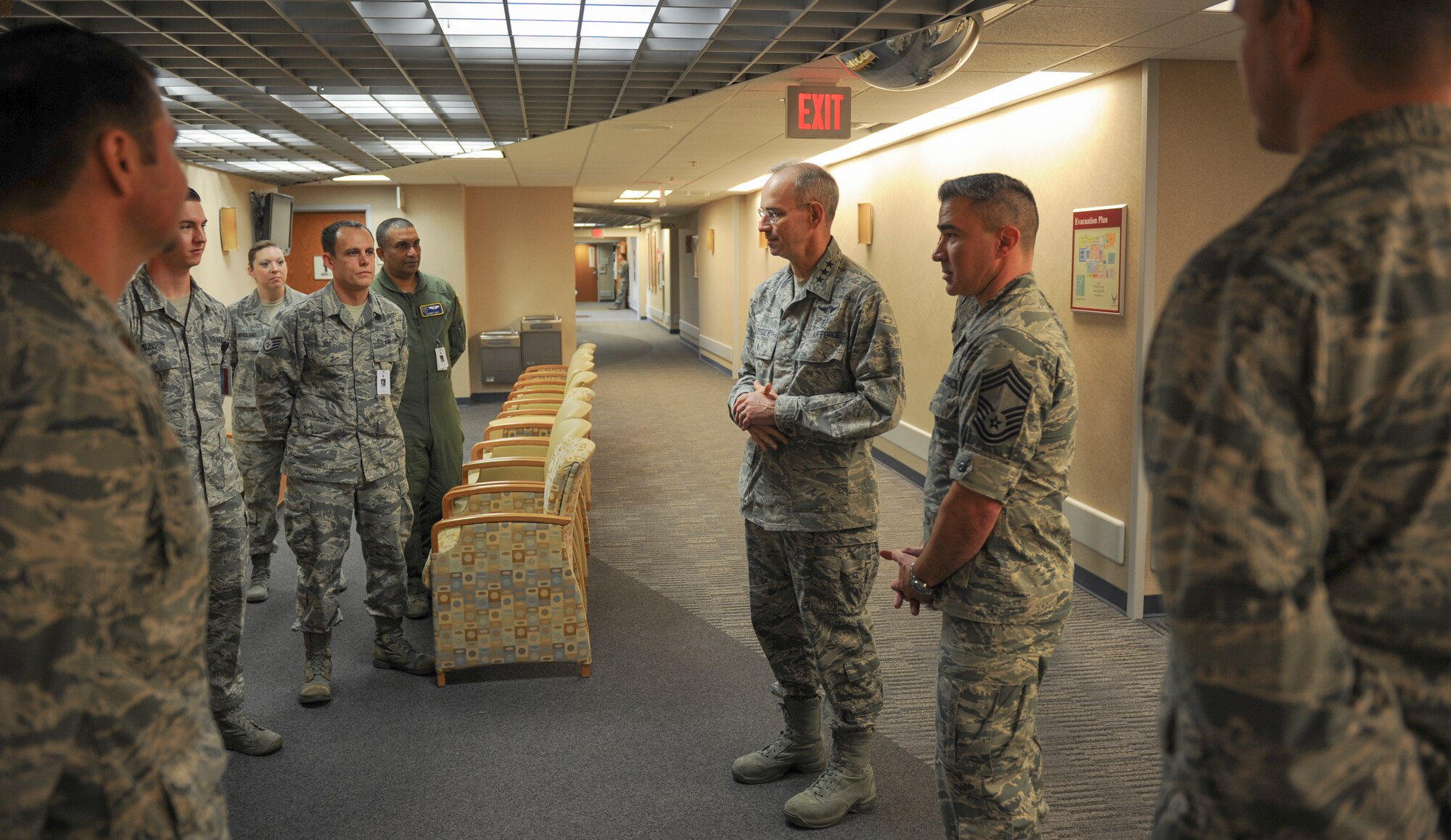 U.S Air Force Surgeon General Lt. Gen. Mark Ediger, center, and Chief Master Sgt. Jason Pace, Medical Enlisted Force chief, speak with Airmen from the 19th Aerospace Medicine Squadron flight medicine element Dec. 16, 2015, at Little Rock Air Force Base, Ark. Ediger advises the Secretary of the Air Force and Air Force Chief of Staff, as well as the Assistant Secretary of Defense for Health Affairs on matters pertaining to the medical aspects of the air expeditionary force and the health of Air Force people. (U.S. Air Force photo/Senior Airman Harry Brexel)