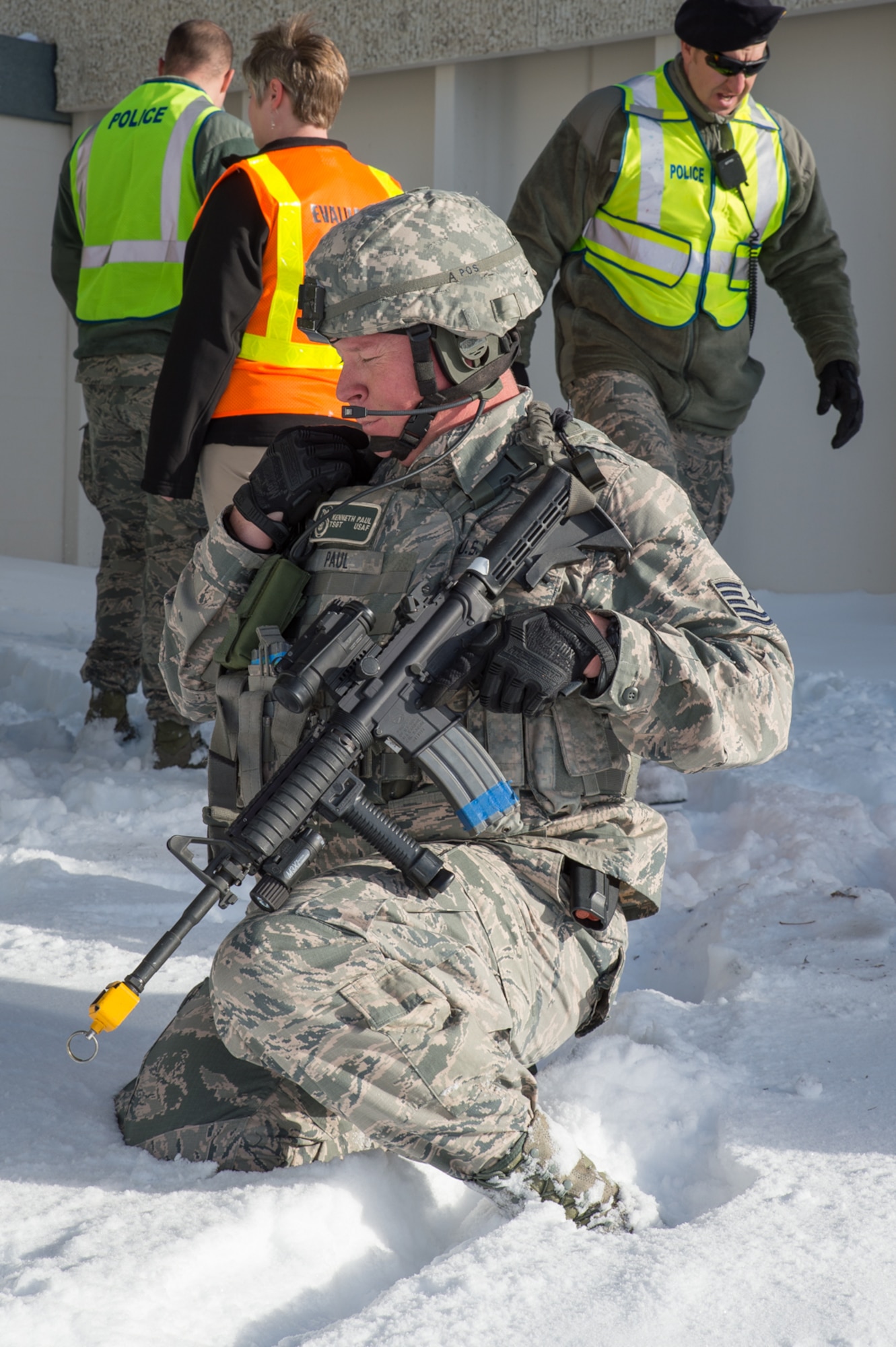 U.S. Air Force Tech. Sgt. Kenneth Paul, 153rd Security Forces Squadron, communicates with the Base Defense Operations Center, Dec. 18, 2015 at Cheyenne Air National Guard base in Cheyenne, Wyoming. Paul and several security forces Airmen chased down and eliminated a gunman during an exercise in which an active shooter attempted to fatally wound as many people as possible before being captured or killed. The scenario was in support of memorandum sent by Secretary of the Air Force Deborah James to test lockdown and active shooter procedures in response to shootings in Chattanooga, Tenn. (U.S. Air National Guard photo by Master Sgt. Charles Delano)