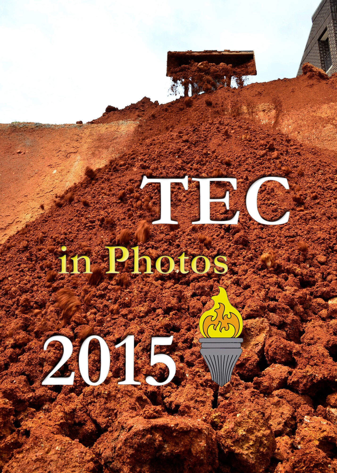MCGHEE TYSON AIR NATIONAL GUARD BASE, Tenn. - The TEC celebrates 2015 in photos. A construction crew member pushes dirt towards the retaining wall at the facility construction site here Apr. 29, 2015 at the I.G. Brown Training and Education Center. An estimated 50 dump truck loads of dirt and gravel were needed to fill in the excavated area.  (U.S. Air National Guard photo illustration/Released)