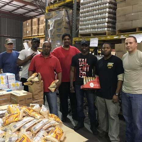 Soldiers and civilians from the 841st Transportation Battalion on Joint Base Charleston – Weapons Station, S.C. participated in a community service event on Dec. 16, 2015. The volunteers assisted the Low Country Food Bank (LCFB) by packing Holiday Cheer boxes and packaging incoming food donations. The LCFB is a non-profit organization fighting to end hunger in 10 South Carolina counties as well as providing much needed disaster relief. Volunteers are heavily relied on to keep their production lines going. It took the JB Charleston volunteers, along with others, approximately five hours to pack about 80,000 lbs. of food into 2,200 boxes for distribution. (Army photo by Sgt. Denis Ortiz)