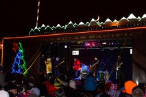 Kira Isabella, a Canadian country singer, and the Holiday Train Band performs on the Canadian Pacific Holiday Train at the Old Soo Depot Transportation Museum in Minot, N.D., Dec. 15, 2015. The Holiday Train travels through dozens of communities, raising food and cash donations for North American food banks. This year train donated $6,000 to the Minot Area Homeless Coalition. (U.S. Air Force photo/Airman 1st Class Matt Rauschnot)