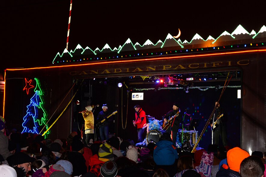Kira Isabella, a Canadian country singer, and the Holiday Train Band performs on the Canadian Pacific Holiday Train at the Old Soo Depot Transportation Museum in Minot, N.D., Dec. 15, 2015. The Holiday Train travels through dozens of communities, raising food and cash donations for North American food banks. This year train donated $6,000 to the Minot Area Homeless Coalition. (U.S. Air Force photo/Airman 1st Class Matt Rauschnot)