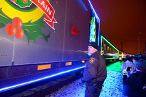 A sheriff deputy of Ward County, N.D., ensured public safety as the Canadian Pacific Holiday Train stops at the Old Soo Depot Transportation Museum in Minot, N.D., Dec. 15, 2015. The train visits communities in Quebec, New York and southern Ontario before traveling across states in the northeast and Midwest, before returning to Canada for its final stops in Saskatchewan and Alberta. The train features 14 railcars decorated with hundreds of thousands of lights and holiday-themed performances by professional musicians. (U.S. Air Force photo/Airman 1st Class Matt Rauschnot)