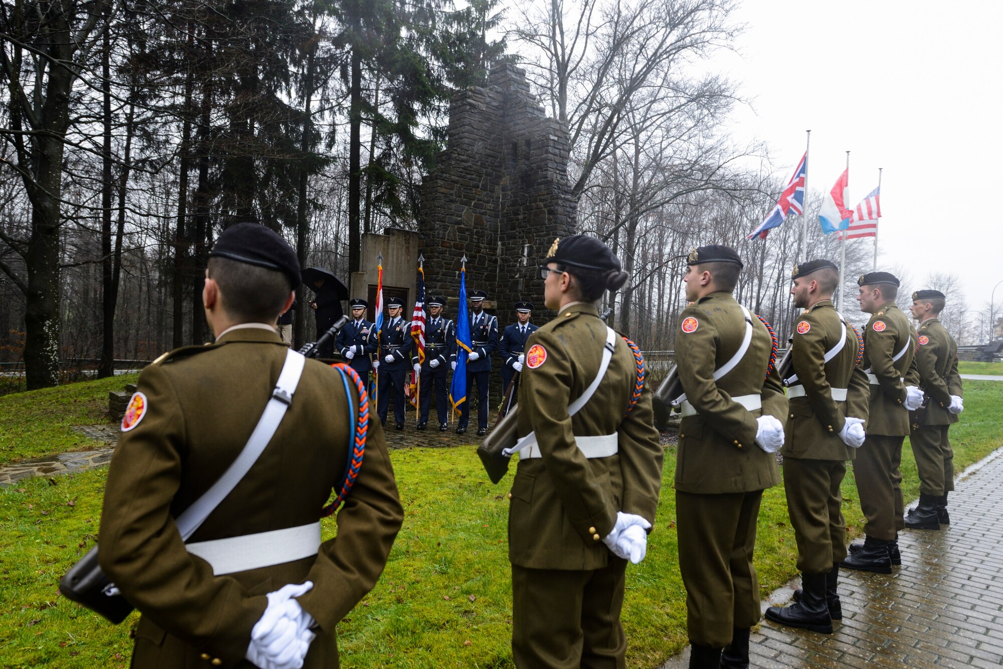 U.S. Air Force Honor Guardsmen assigned to the 52nd Fighter Wing and Luxembourg Army Honor Guard members participate in a Battle of the Bulge anniversary ceremony at the National Liberation Memorial in Schumanns Eck, Luxembourg, Dec. 16, 2015. The battle took place in parts of Belgium, France, Luxembourg and Germany beginning in the winter of 1944. (U.S. Air Force photo by Staff Sgt. Christopher Ruano/Released)