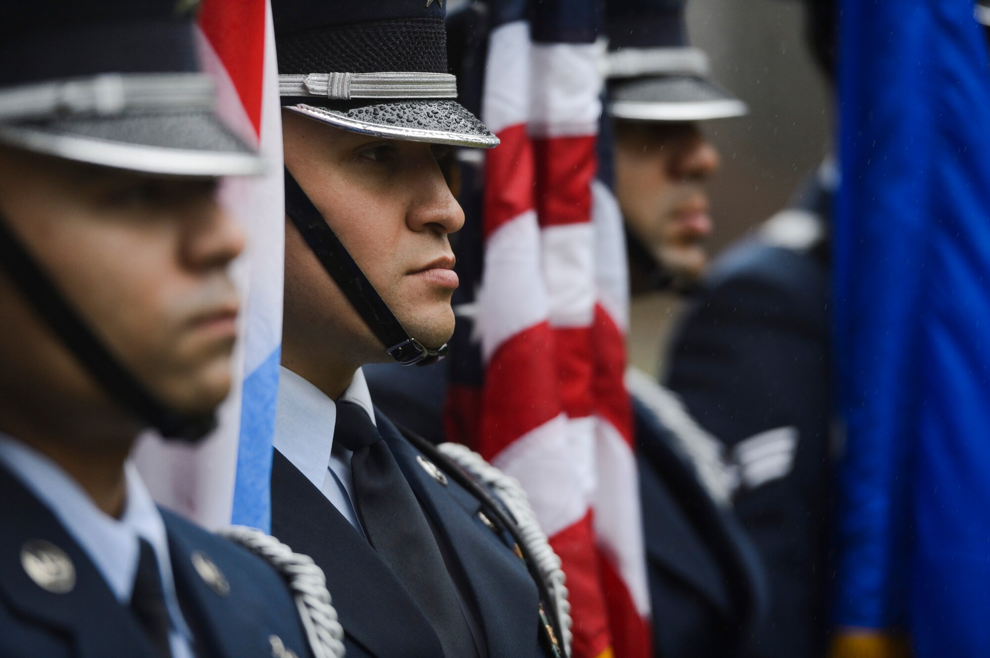 U.S. Air Force Honor Guardsmen, assigned to the 52nd Fighter Wing stand at attention during a Battle of the Bulge anniversary ceremony at the National Liberation Memorial in Schumanns Eck, Luxembourg, Dec. 16, 2015. The ceremony commemorated the 71st anniversary of the beginning of the battle which began on Dec. 16, 1944. (U.S. Air Force photo by Staff Sgt. Christopher Ruano/Released)
