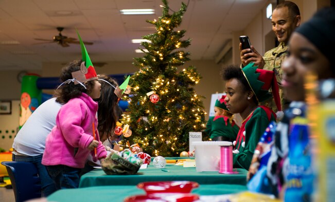 Patrons participate in the Ramstein Community Center’s Elf Boot Camp Dec. 14, 2015, at Ramstein Air Base, Germany. The children participated in multiple activities throughout the event to see if they had the qualities to be an elf at the North Pole. (U.S. Air Force photo/Airman 1st Class Tryphena Mayhugh)