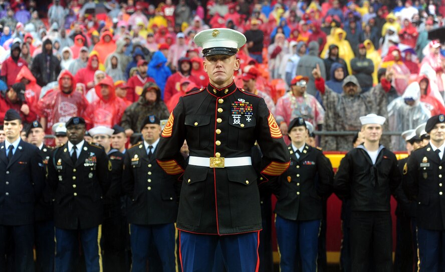 U.S. Marine Corps Sgt. Maj. Christopher A. Farrell, the Marine Corps Recruiting Station Kansas City sergeant major, stands ready to command a formation of joint service members participating in the flag detail at Arrowhead Stadium in Kansas City, Mo., Dec. 13, 2015. Following the pre-game events, the Kansas City Chiefs competed against the San Diego Chargers during the 2015 Military Appreciation Game. (U.S. Air Force photo by Airman 1st Class Jazmin Smith)