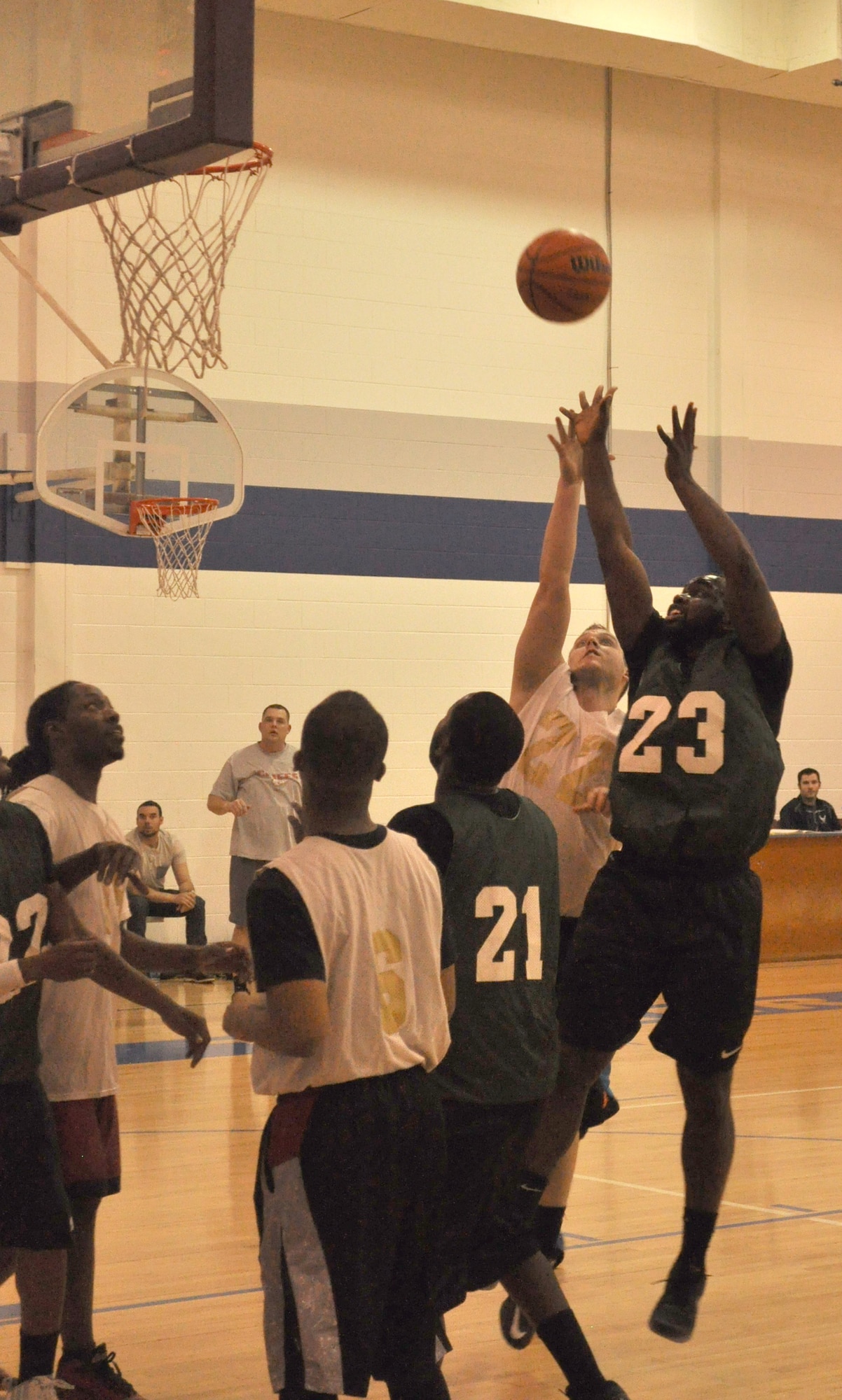 72 MDG’s Brandon Hibner and 72 SFS’ Joseph Currie vie for the ball in their Dec. 9 game at the Gerrity Fitness Center. Med Group won 59-40.  (Air Force photo by John Parker/Released)