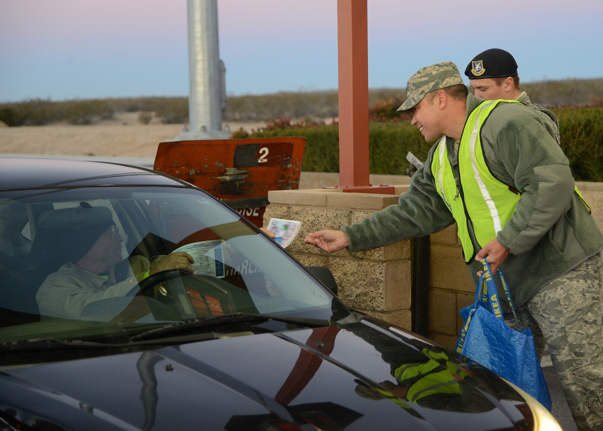 Lt. Col. Allen Goodwin, 412th Test Wing Inspector General, handed out candy canes and safety pamphlets to encourage people to enjoy the holidays safely Dec. 18. (U.S. Air Force photo by Rebecca Amber)