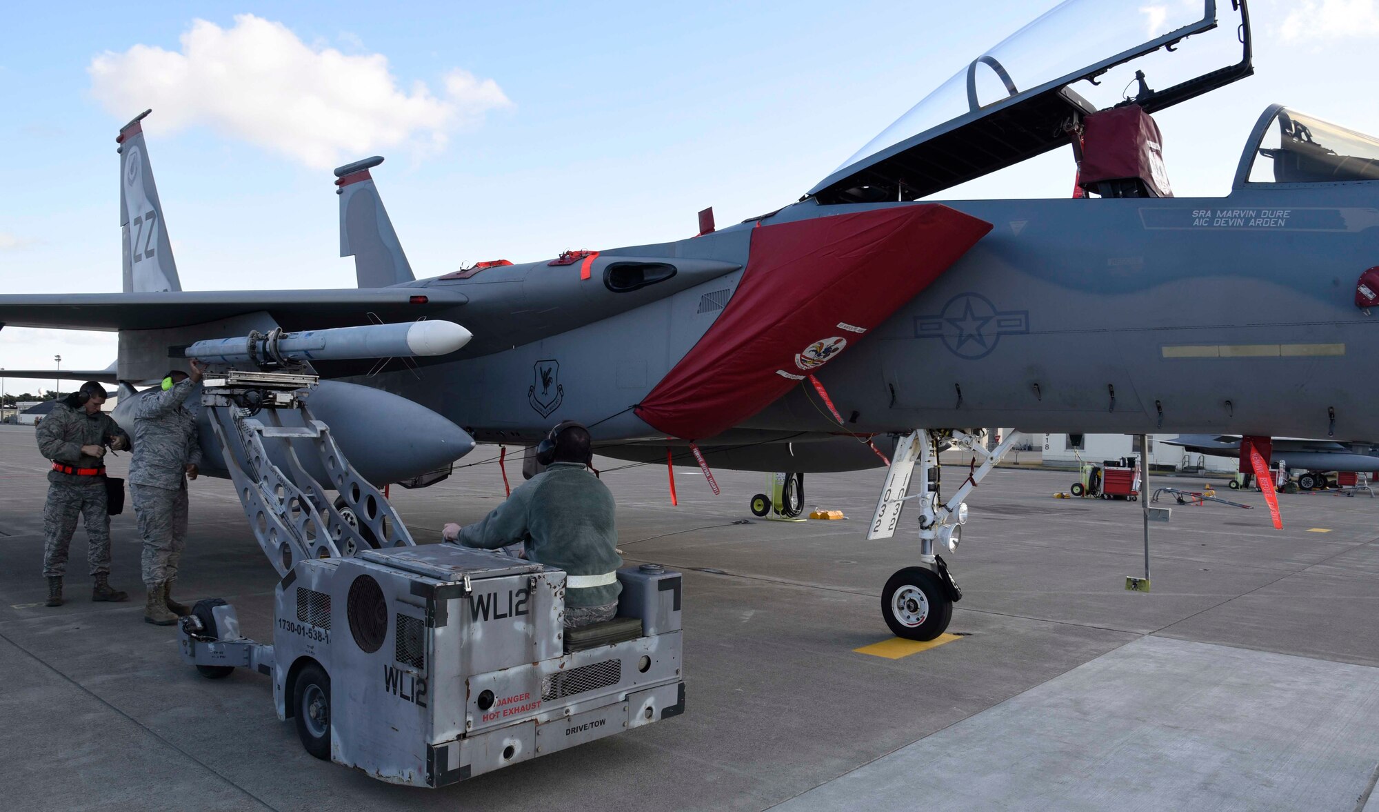 Weapons load crew Airmen with the 18th Aircraft Maintenance Squadron load an advanced medium-range air-to-air missile onto an F-15 Eagle at Misawa Air Base, Japan, Dec. 14, 2015. These Airmen are part of an Aviation Training Relocation at Misawa AB with a goal of increasing interoperability between U.S. and Japanese forces and enhancing operational readiness. (U.S. Air Force photo by Airman 1st Class Jordyn Fetter/Released)