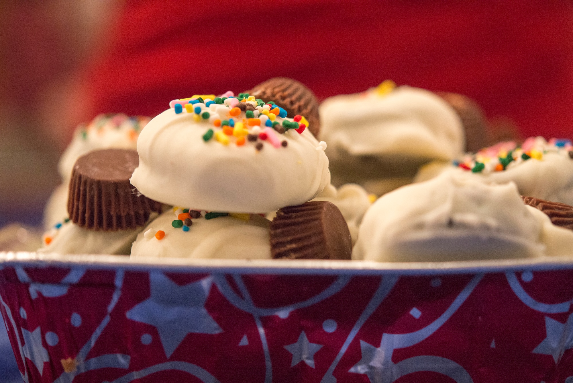 Holiday cookies baked by volunteers sit in a tray as they are packed into boxes at the Rocker NCO Club, Dec. 14, 2015, at Kadena Air Base, Japan. More than 30,000 cookies were collected for the annual holiday cookie drive over a two day period and packaged into boxes of 12, which were then delivered to approximately 2,500 Airmen, Soldiers, Sailors and Marines living in dormitories on Kadena. (U.S. Air Force photo by Senior Airman Omari Bernard)