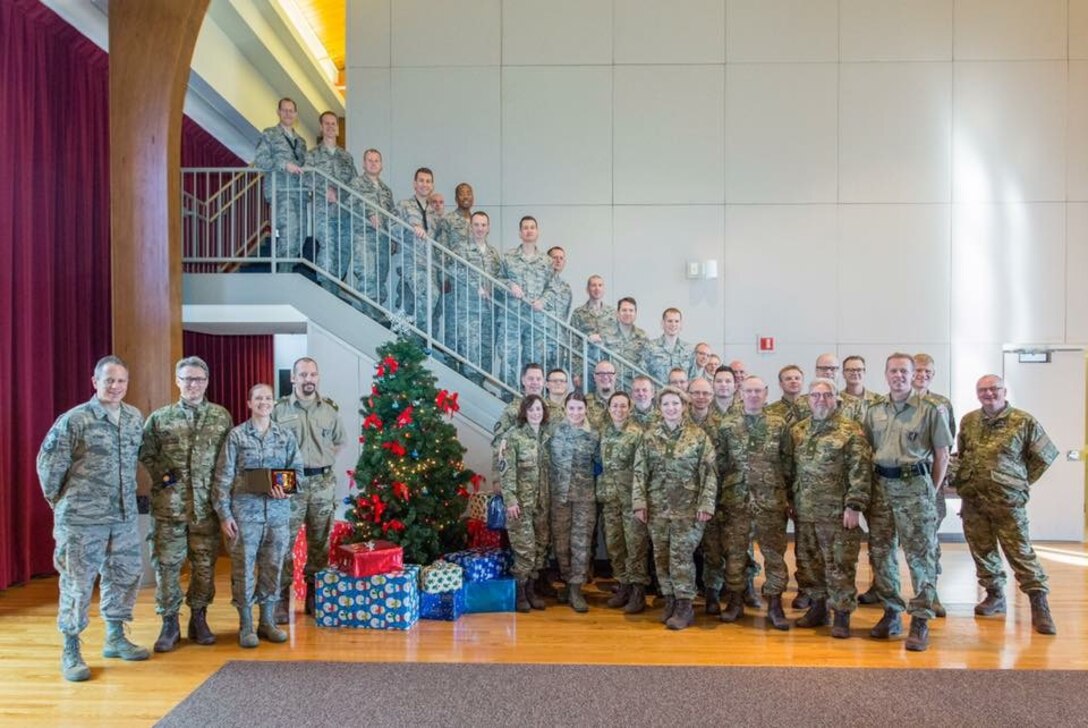 The United States Air Force Band enjoyed a visit from Slesvigske Musikkorps, a group of Danish military musicians.  They posed with their Chief Conductor, Peter Ettrup Larsen and the Airmen of Note. (U.S. Air Force Photo by Lieutenant Commander Jim Remington/released)