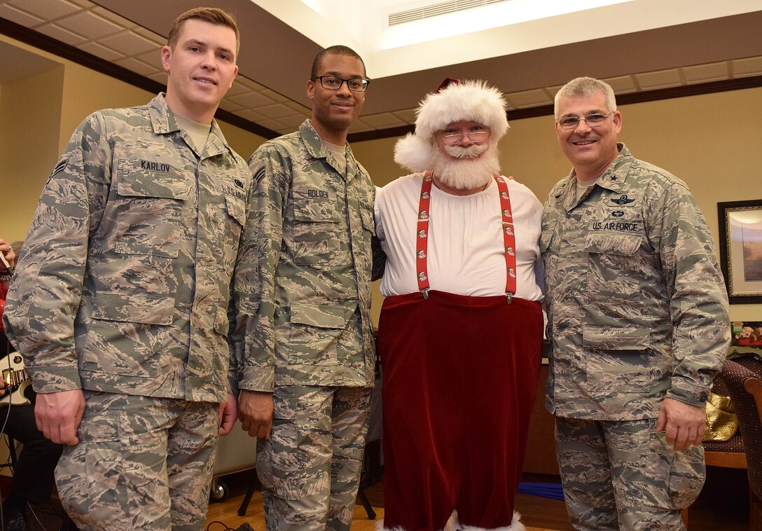 Brig. Gen. Tony Carrelli, Deputy Adjutant General - Air of the Pa. National Guard, and  111th Attack Wing members pose for a photo with Santa Claus, world-renowned toymaker, during a veterans' skilled-nursing facility visit Dec. 17, 2015. (U.S. Air National Guard photo by Master Sgt. Chris Botzum/Released)