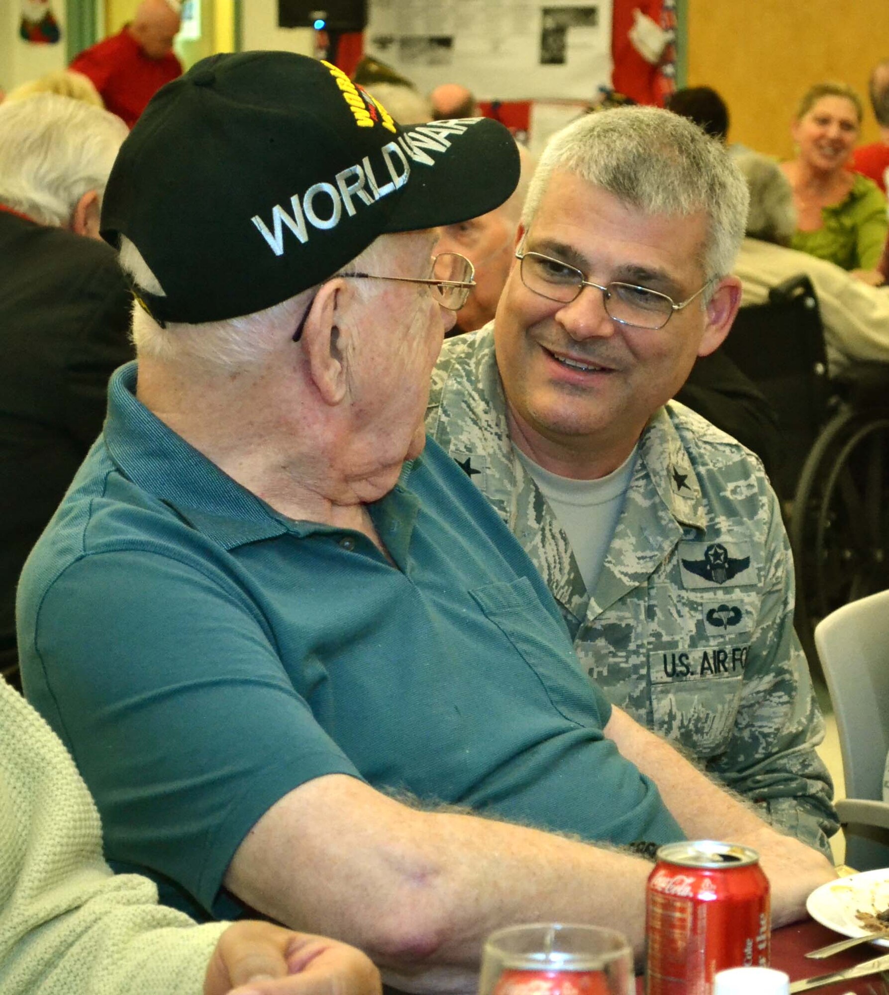 Brig. Gen. Tony Carrelli, Deputy Adjutant General - Air of the Pa. National Guard, speaks with a resident at Delaware Valley Veterans' Home in Philadelphia, Pennsylvania, Dec. 17, 2015. Members of the Pa. National Guard visited two veterans' skilled-nursing facilities to spread holiday cheer (U.S. Air National Guard photo by Tech. Sgt. Andria Allmond/Released).