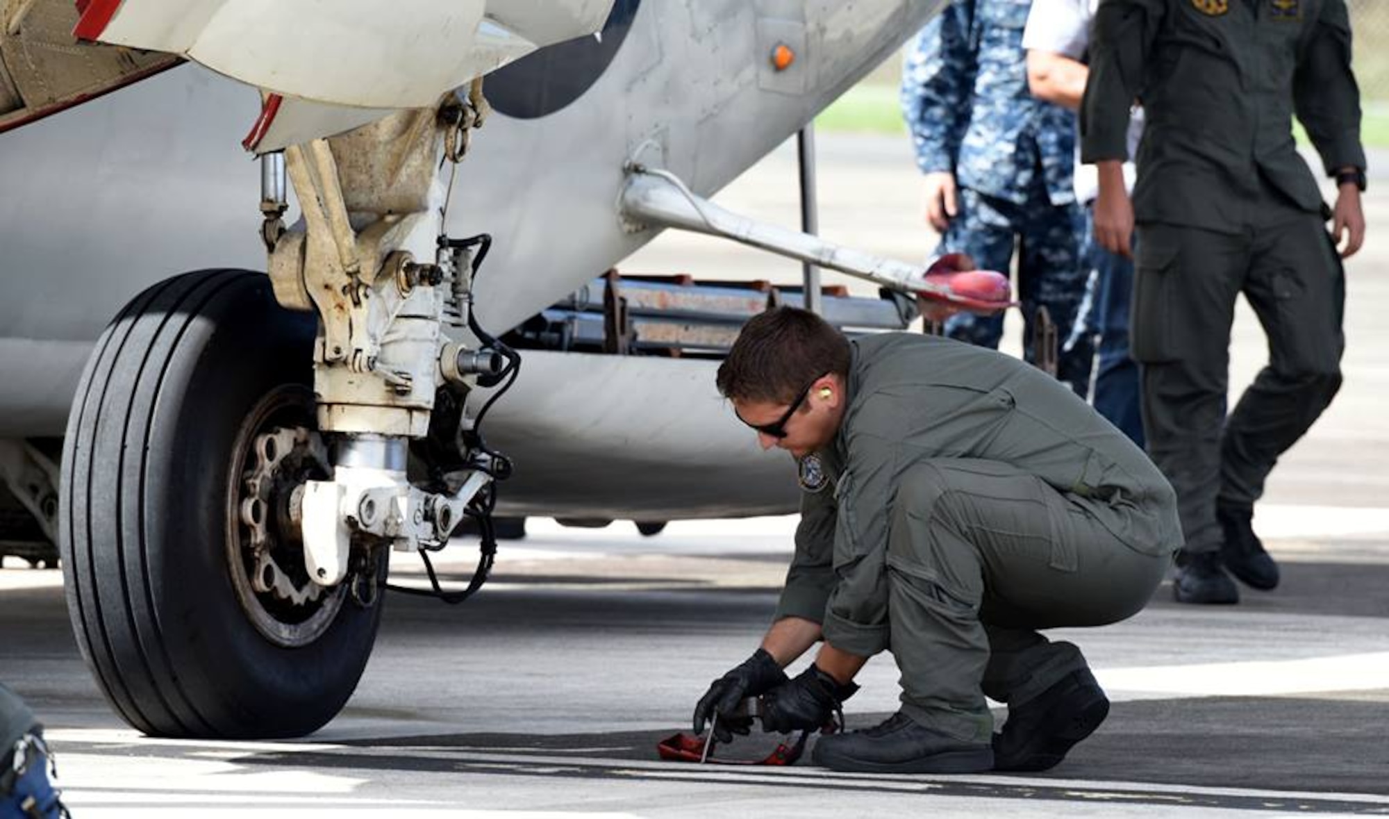 The 156th Airlift Wing, provides logistical and maintenance support to the Navy on Puerto Rico Air National Guard Base Muñiz during the week of Dec 5 thru 11, 2015. Two Navy C-2 cargo planes flew in from the USS George Washington Aircraft Carrier to drop off navy personnel, and pick up pre-ordered supplies and equipment for the vessel. The mission is to provide logistical support for the vessel’s journey from San Diego, California to South America, ending its last leg in Norfolk, Virginia. (U.S. Air National Guard photo by Tech Sgt. Efrain Sanchez)
