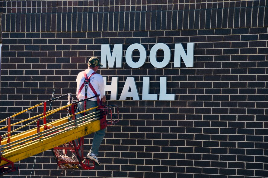 MCGHEE TYSON AIR NATIONAL GUARD BASE, Tenn. - A worker installs the Moon Hall letters onto Building 412 here April 1, 2015. The I.G. Brown Training and Education Center dedicated the dormitory building April 9 in honor of retired Chief Master Sgt. Richard Moon, a former commandant who had served as the fifth senior enlisted advisor to the Director of the Air National Guard.  (U.S. Air National Guard photo by Master Sgt. Jerry Harlan/Released)