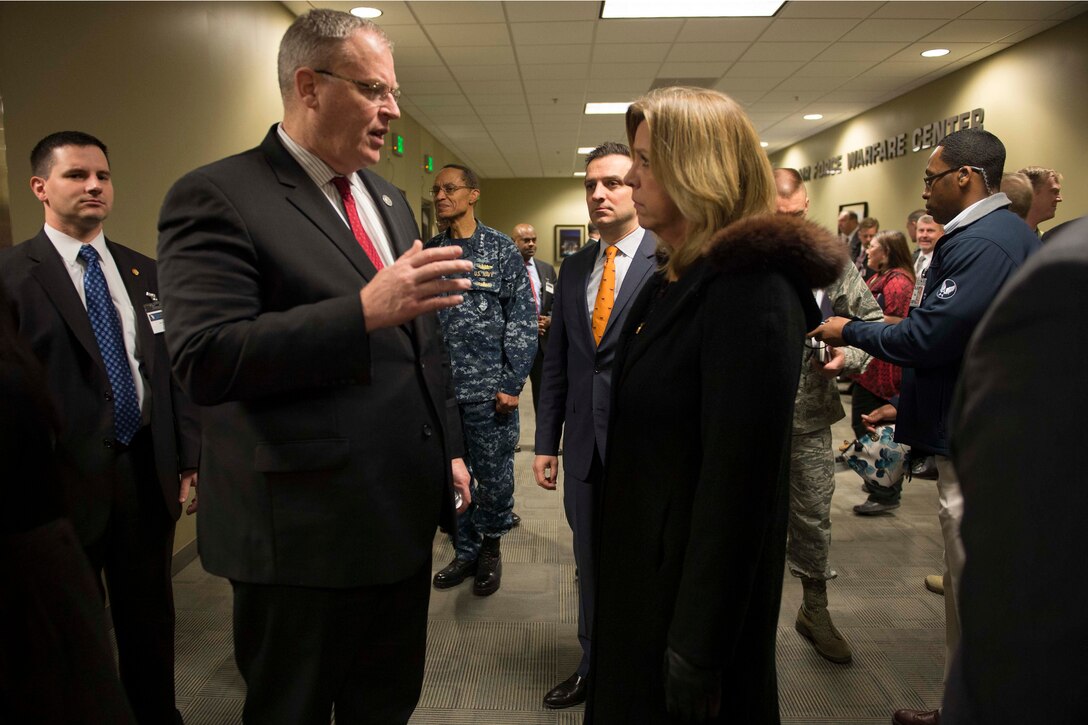 Deputy Defense Secretary Bob Work speaks with Air Force Secretary Deborah Lee James on Schriever Air Force Base, Colo., Dec. 17, 2015. DoD photo by Navy Petty Officer 1st Class Tim D. Godbee