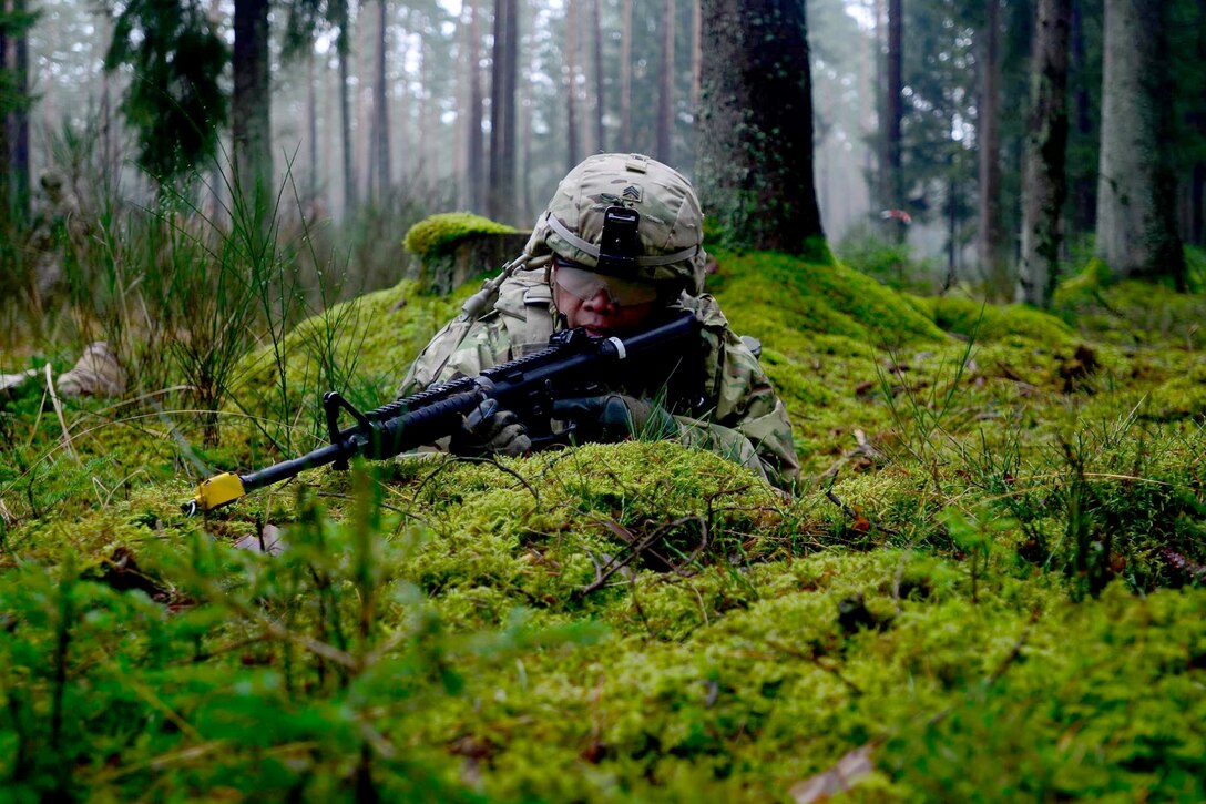 A U.S. soldier provides security during a convoy exercise on Grafenwoehr Training Area, Germany, Dec. 15, 2015. The soldier is assigned to the 18th Military Police Brigade, 21st Theater Sustainment Command. U.S. Army photo by Pfc. Emily Houdershieldt