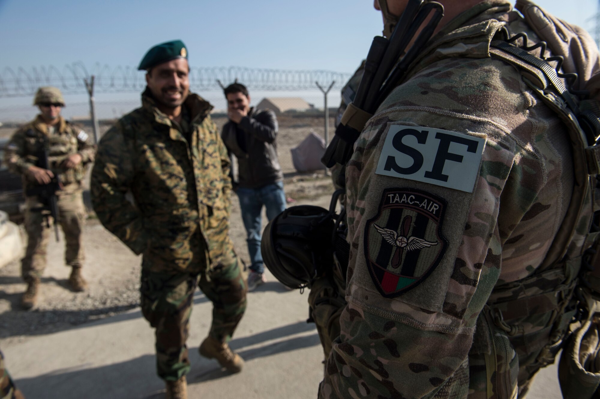 Train, Advise, Assist Command-Air (TAAC-Air) security forces advisors visit Afghan Air Force soldiers near Forward Operating Base Oqab, Kabul, Afghanistan, Dec. 13, 2015. TAAC-Air security forces soldiers visit the Afghans at different security posts on base a couple times a week. (U.S. Air Force photo by Staff Sgt. Corey Hook/Released)