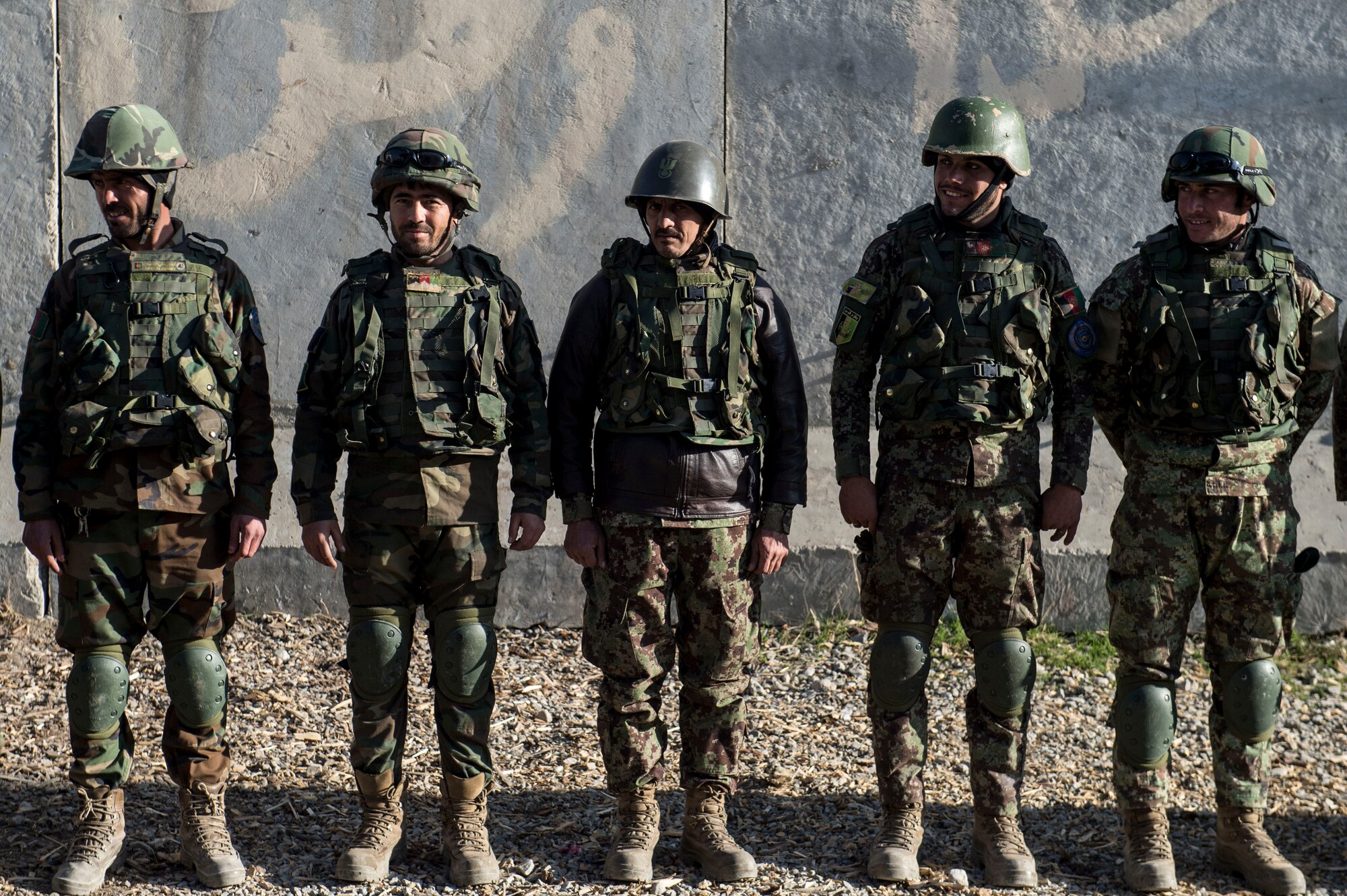 Afghan Air Force soldiers stand in formation near Forward Operating Base Oqab, Kabul, Afghanistan, Dec. 13, 2015. Train, Advise, Assist Command-Air (TAAC-Air) security forces advisors visit the Afghans at different security posts on base a couple times a week. (U.S. Air Force photo by Staff Sgt. Corey Hook/Released)