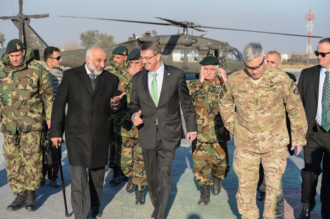 U.S. Defense Secretary Ash Carter, center, walks with  General John Campbell, right, and Afghanistan Defense Minister Mohammed Masoom Stanekzai on Forward Operating Base Fenty, Dec. 18, 2015. DoD photo by U.S. Army Sgt. 1st Class Clydell Kinchen