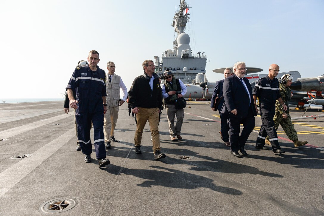 U.S. Defense Ash Carter departs the deck of the flagship of the French Navy the Charles de Gaulle on Dec. 19, 2015. Carter is on a weeklong trip in which he is visiting leaders and deployed service members in the Middle East and Afghanistan. DoD photo by Army Sgt. 1st Class Clydell Kinchen