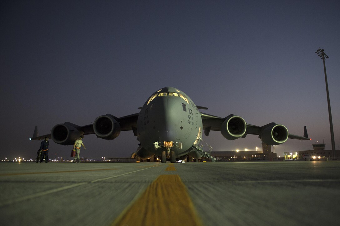 U.S. airmen prepare to deliver fuel to coalition bases in Iraq on Al Udeid Air Base, Qatar, Dec. 16, 2015. The airmen are supporting Operation Inherent Resolve, the coalition intervention against the Islamic State of Iraq and the Levant. U.S. Air Force photo by Tech. Sgt. Nathan Lipscomb