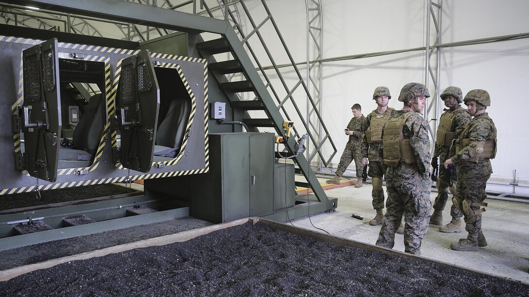 Marines with 2nd Supply Battalion, 2nd Marine Logistics Group wait to take part in a Humvee Egress Assistance Trainer class at Marine Corps Base Camp Lejeune, N.C., Dec. 17, 2015.  The HEAT class is designed to show Marines what to do if a vehicle rolls over during low visibility, no visibility, or experiences sideways or 180-degree rollovers.  