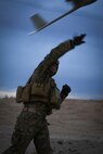 Lance Cpl. Travis DeShazo, a rifleman assigned to Company E, 2nd Battalion, 4th Marine Regiment, 1st Marine Division, throws a Raven unmanned aerial system to establish the location of notional enemy units aboard Marine Corps Air Ground Combat Center, California, Dec. 10, 2015. The Marines employed the Raven UAS as part of Steel Knight to gain a better understanding of it and develop a higher proficiency of what it takes to operate as a more effective as the ground combat element of the I Marine Expeditionary Force. (U.S. Marine Corps photo by Cpl. Will Perkins/RELEASED)