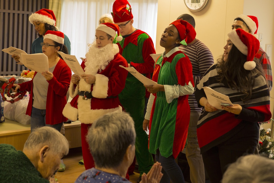 Volunteers from Marine Corps Air Station Iwakuni, Japan, sing Christmas carols to residents at the Vita Nursing Home in Iwakuni, Dec. 16, 2015. The chapel coordinated this community event as an opportunity to experience Japanese culture, give back to the local community and strengthen the bond between the U.S. and Japan.