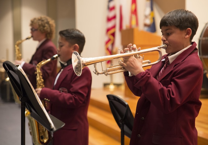 Andrew Pfeil, a concert band participant, plays the trumpet in the concert band during the annual holiday concert at Marine Memorial Chapel at Marine Corps Air Station Iwakuni, Japan, Dec. 8, 2015. The Samurai Choir, concert band, symphonic band, elementary school chorus and the Japanese guests performed an array of holiday music throughout the night. The holiday concert provided the opportunity for Japanese and American students to interact and perform together.