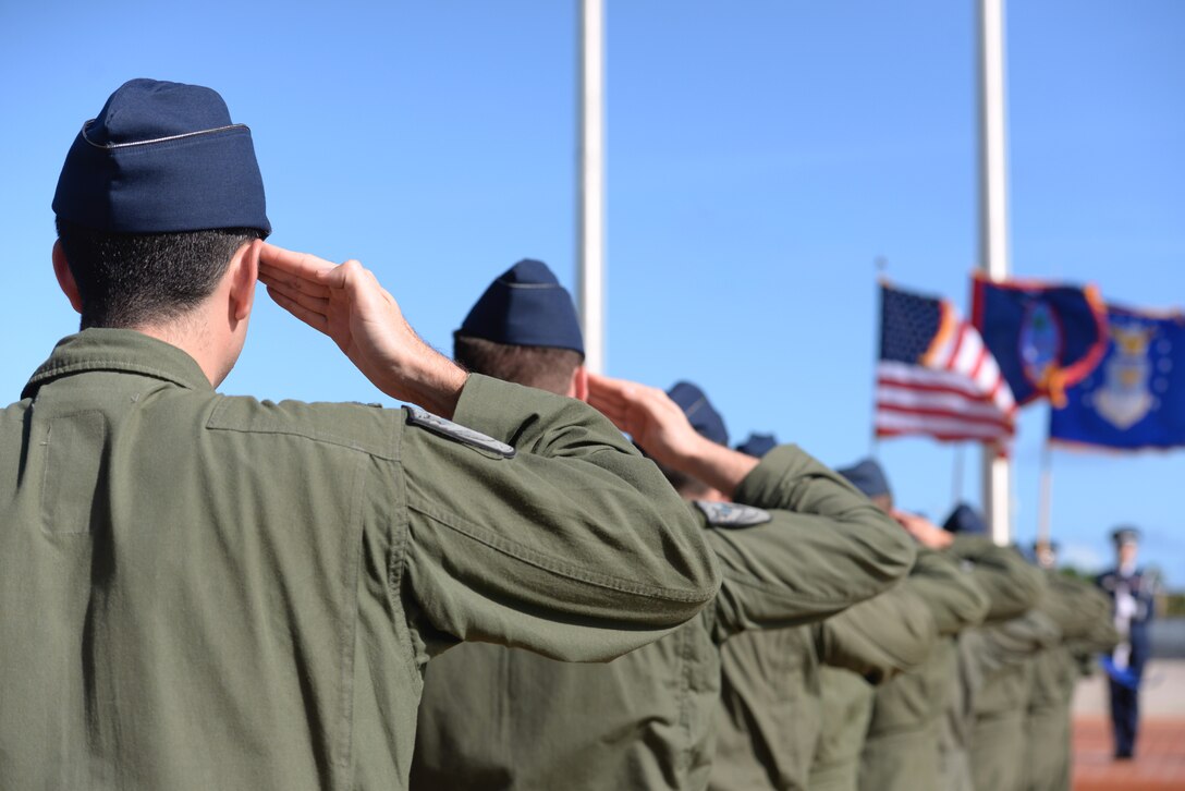 Aviators from the 23rd Expeditionary Bomb Squadron render a salute during the Linebacker II Remembrance Ceremony Dec. 18, 2015, at Andersen Air Force Base, Guam. During the ceremony, Airmen from the 23rd EBS made a 33 person formation, signifying the 33 Airmen who died during Operation Linebacker II. (U.S. Air Force photo/Staff Sgt. Benjamin Gonsier)