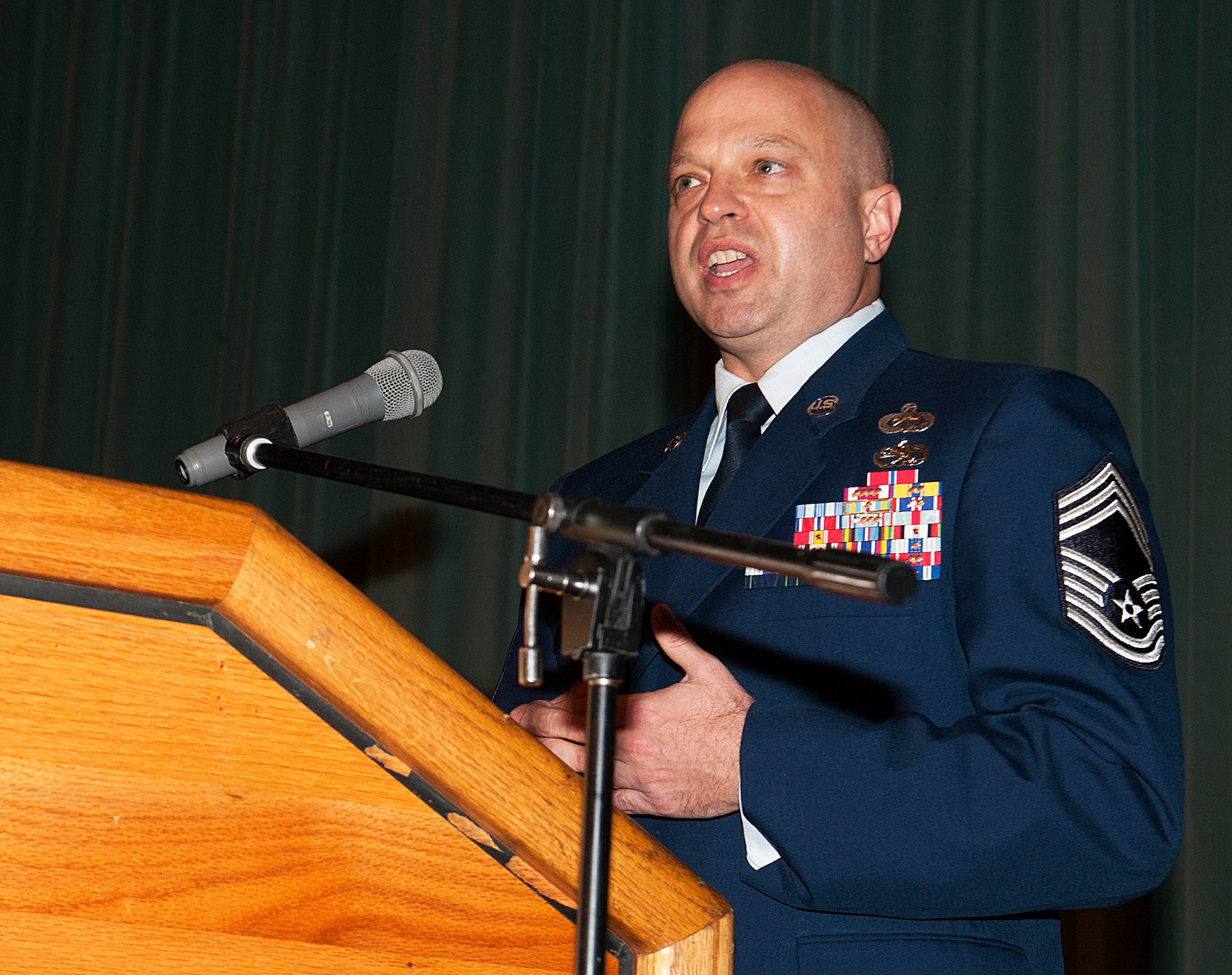 U.S. Air Force Chief Master Sgt. Jeffrey Martin, 18th Mission Support Group superintendent, speaks about the importance of NCO leadership during the NCO Academy Class 16-1 graduation ceremony at the Keystone Theater, Dec. 18, 2015, at Kadena Air Base, Japan. Sixty six students graduated from the six-week military leadership course, readying them for NCO management roles and responsibilities. (U.S. Air Force photo by Naoto Anazawa)