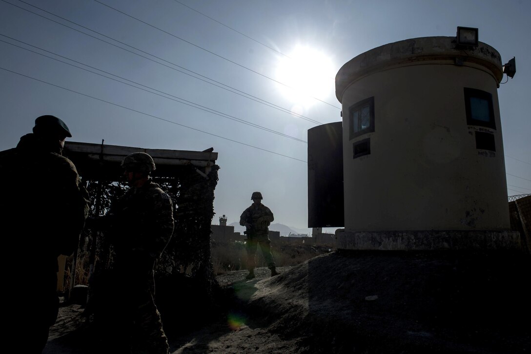 U.S. troops visit Afghan airmen near a security post on Forward Operating Base Oqab in Kabul, Afghanistan, Dec. 13, 2015. U.S. Air Force photo by Staff Sgt. Corey Hook