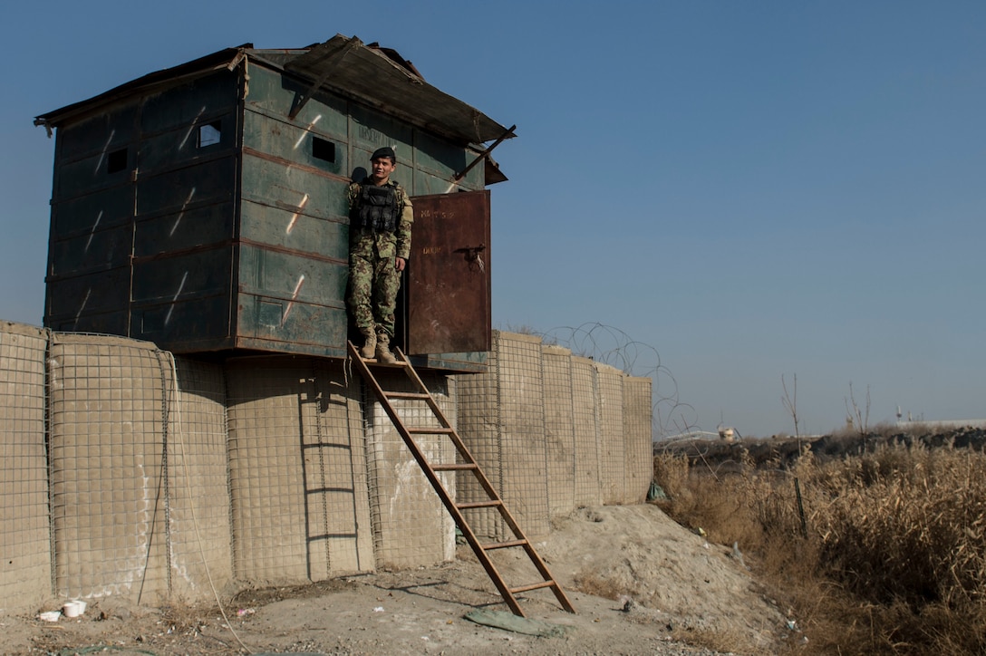 An Afghan airman stands at his security post near Forward Operating Base Oqab in Kabul, Afghanistan, Dec. 13, 2015. U.S. Air Force photo by Staff Sgt. Corey Hook