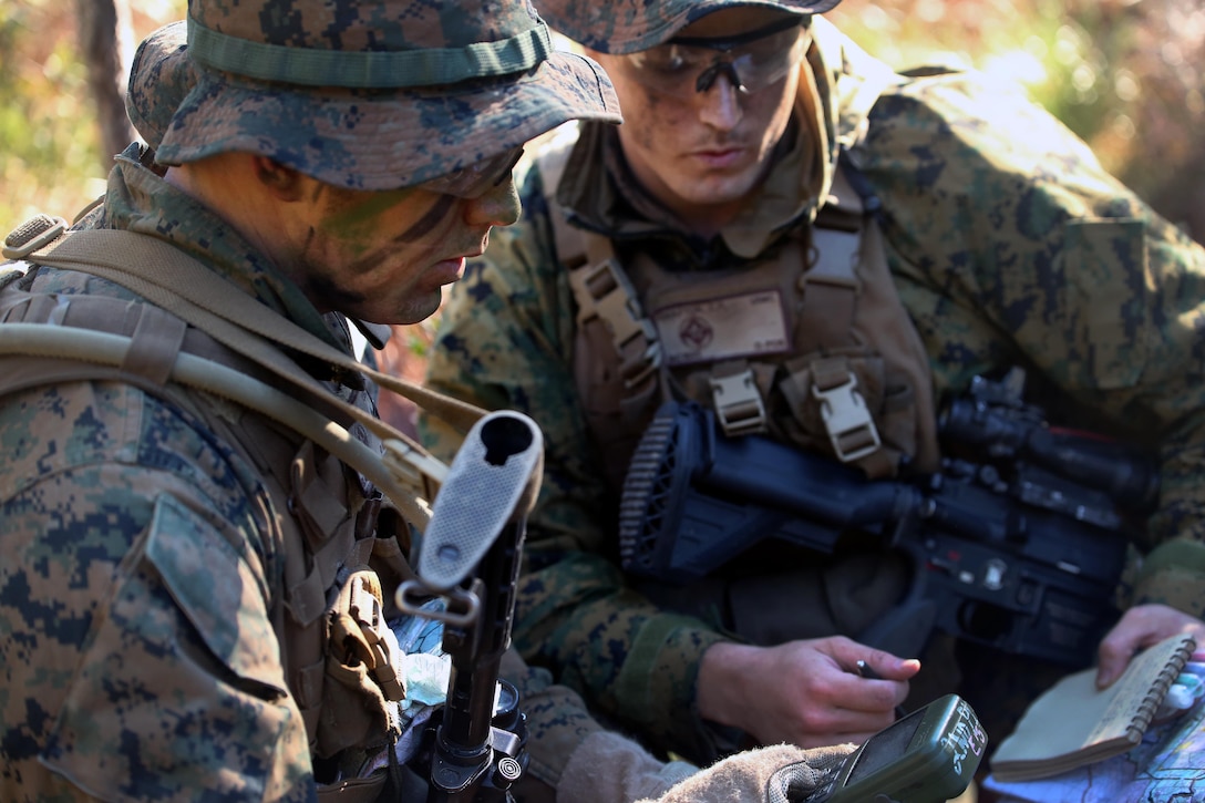 Marines review grid coordinates before beginning a patrol during a patrolling exercise on Camp Lejeune, N.C., Dec 15, 2015. U.S. Marine Corps photo by Lance Cpl. Brianna Gaudi