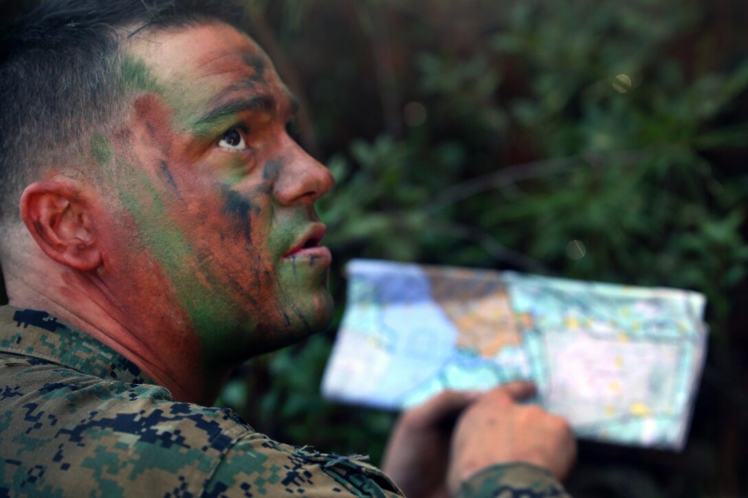 Marine Corps Staff Sgt. Steven Lawson gives out coordinates to platoons during a patrolling exercise at Camp Lejeune, N.C., Dec 15, 2015. Lawson is a chief scout assigned to 2nd Light Armored Reconnaissance Battalion. U.S. Marine Corps photo by Lance Cpl. Brianna Gaudi