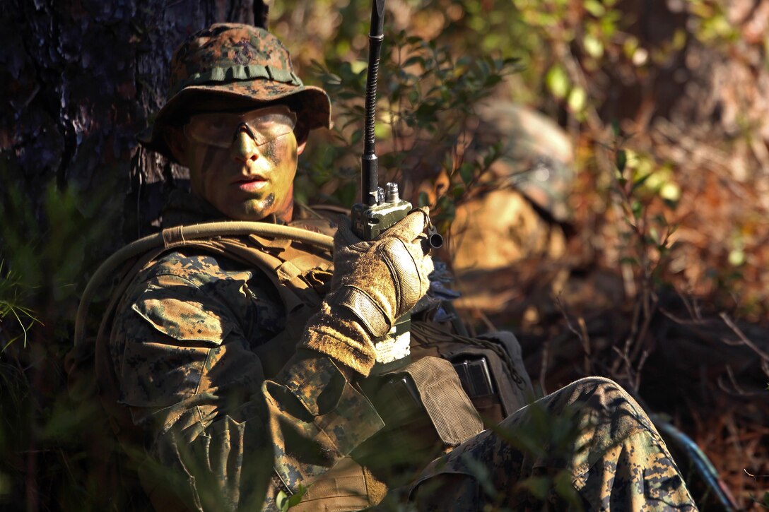 Marine Corps Lance Cpl. Silas Lewis uses a radio to communicate grid coordinates during a patrolling exercise on Camp Lejeune, N.C., Dec 15, 2015. Lewis is a rifleman assigned to 2nd Light Armored Reconnaissance Battalion. U.S. Marine Corps photo by Lance Cpl. Brianna Gaudi