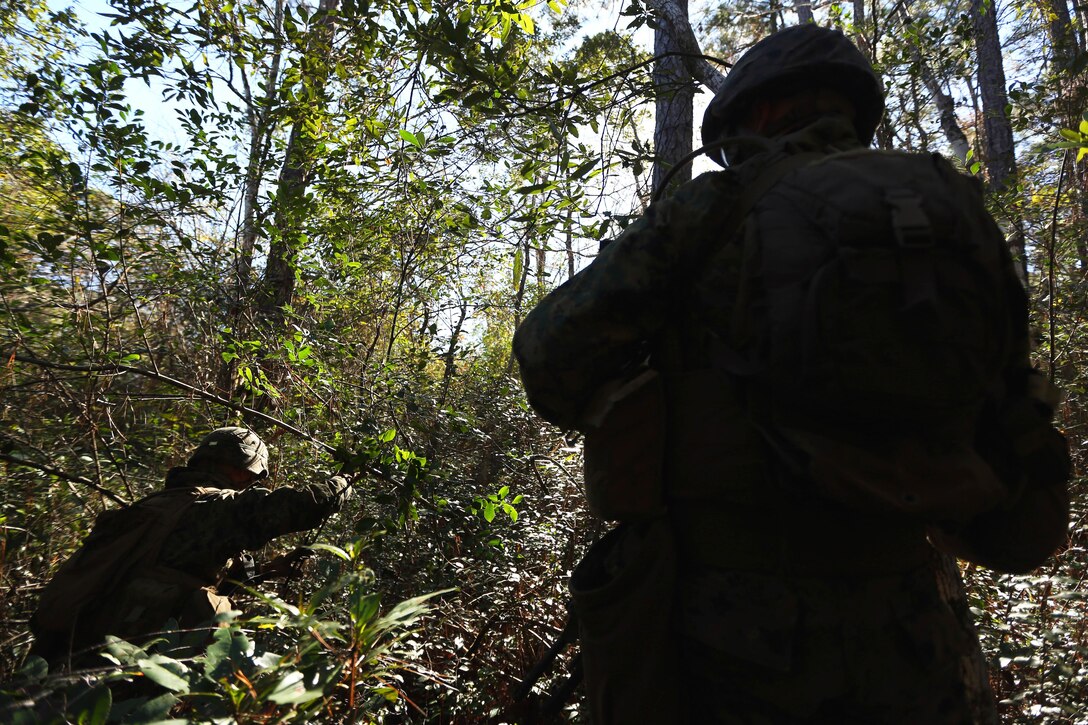 Marines navigate through the woods during a patrolling exercise on Camp Lejeune, N.C., Dec 15, 2015. U.S. Marine Corps photo by Lance Cpl. Brianna Gaudi