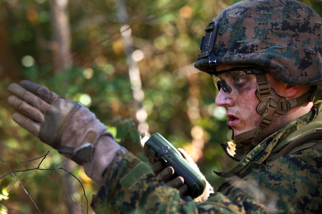 Marine Corps Lance Cpl. Cary Chafton gives directions to his squad during a patrolling exercise at Camp Lejeune, N.C., Dec 15, 2015. Chafton is a rifleman assigned to 2nd Light Armored Reconnaissance Battalion. U.S. Marine Corps photo by Lance Cpl. Brianna Gaudi