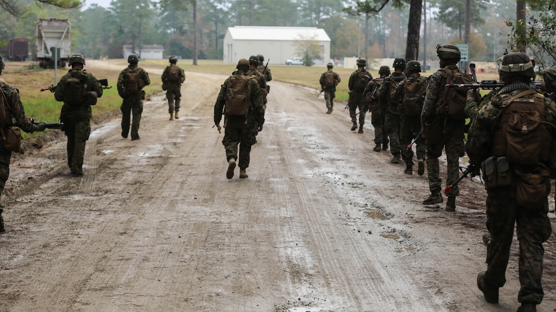 Marines with 3rd Battalion, 6th Marine Regiment, enter the Military Operations in Urban Terrain facility during a limited objective experiment at Marine Corps Base Camp Lejeune, N.C., Dec. 8, 2015. The Marine Corps Warfighting Laboratory worked with 3rd Bn., 6th Marines, and 1st Battalion, 10th Marine Regiment, to test artillery and infantry integration tactics. During the experiment, the company landing team attacked from near the Onslow Beach landing site towards the objective of the Military Operation in Urban Terrain training center. 