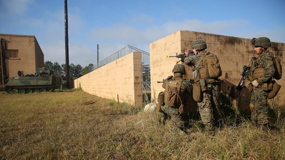Marines with 3rd Battalion, 6th Marine Regiment, provide security during a limited objective experiment at Marine Corps Base Camp Lejeune, N.C., Dec. 8, 2015. The Marine Corps Warfighting Laboratory worked with 3rd Bn., 6th Marines, and 1st Battalion, 10th Marine Regiment, to test artillery and infantry integration tactics. During the experiment, the company landing team attacked from near the Onslow Beach landing site towards the objective of the Military Operation in Urban Terrain training center. 