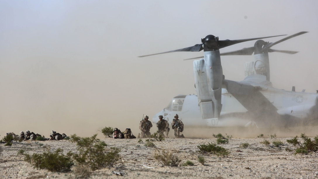 Marines set up a perimeter around an MV-22B Osprey tiltrotor aircraft during a Tactical Recovery of Aircraft and Personnel mission as part of a Marine Corps Combat Readiness Evaluation at Marine Corps Air Ground Combat Center Twentynine Palms, Calif., Dec. 3, 2015. TRAP’s placement in a MCCRE is meant to evaluate Marines on this mission set which is performed for the specific purpose of the recovery of personnel, equipment, and/or aircraft by the insertion of a TRAP force. The Marines are with 2nd Battalion, 7th Marine Regiment, 1st Marine Division.