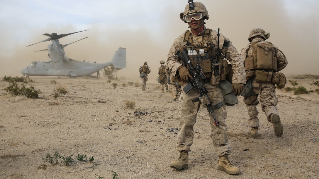 Staff Sgt. Evan Eldridge provides watch for his team as they prepare to board an MV-22B Osprey during the Tactical Recovery of Aircraft and Personnel portion of the battalion’s Marine Corps Combat Readiness Exercise at Marine Corps Air Ground Combat Center Twentynine Palms, Calif., Dec. 3, 2015. TRAP’s placement in a MCCRE is meant to evaluate Marines on this mission set which is performed for the specific purpose of the recovery of personnel, equipment, and/or aircraft by the insertion of a TRAP force. Staff Sgt. Eldridge is a platoon sergeant with Company F, 2nd Battalion, 7th Marine Regiment, 1st Marine Division.