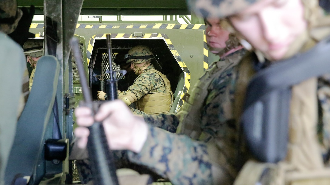 Marines with 2nd Supply Battalion, 2nd Marine Logistics Group prepare to conduct a Humvee Egress Assistance Trainer class at Marine Corps Base Camp Lejeune, N.C., Dec. 17, 2015.  The HEAT class is designed to show Marines what to do if a vehicle rolls over during low visibility, no visibility, or experiences sideways or 180-degree rollovers.  