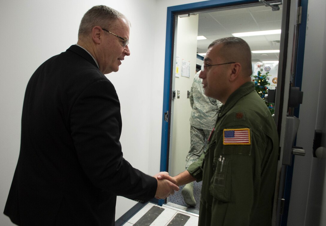 Deputy Defense Secretary Bob Work greets a service member on Cheyenne Mountain Air Force Station, Colo., Dec 18, 2015. Work is in Colorado to meet with defense leaders and tour local commands. DoD photo by Navy Petty Officer 1st Class Tim D. Godbee