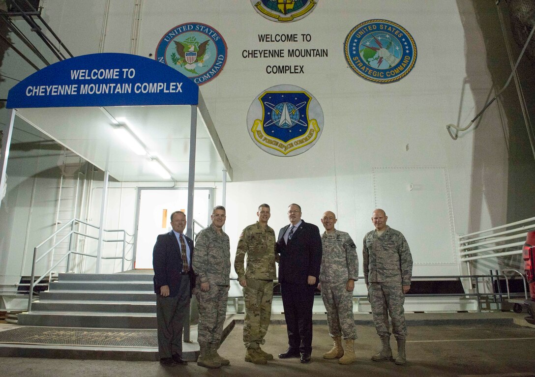 Deputy Defense Secretary Bob Work poses with local leaders on Cheyenne Mountain Air Force Station, Colo., Dec. 18, 2015. Work is in Colorado to meet with defense leaders and tour local commands. DoD photo by Navy Petty Officer 1st Class Tim D. Godbee