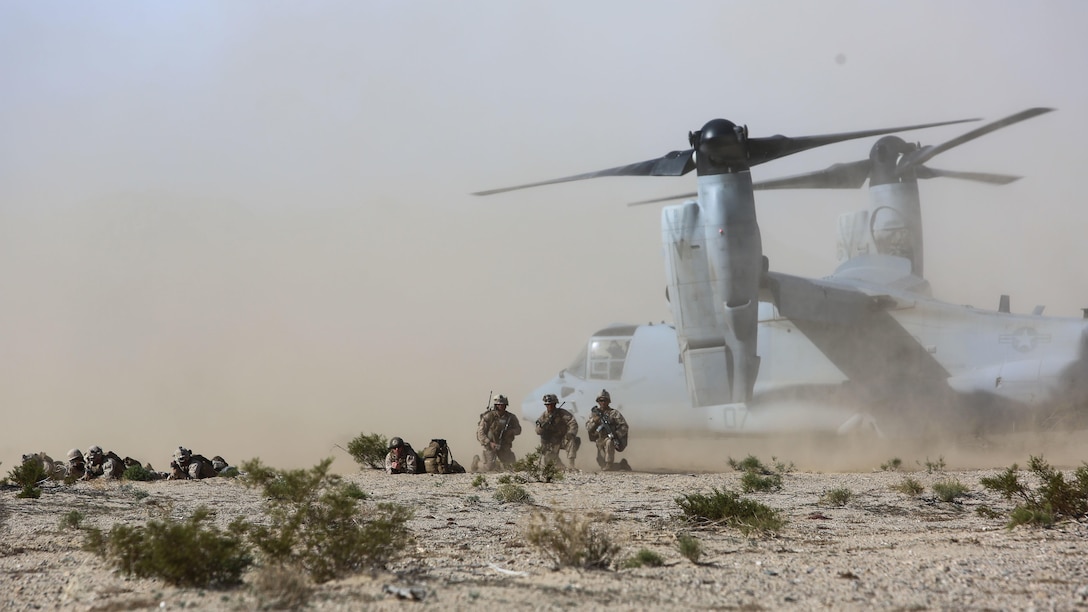 Marines set up a perimeter around an MV-22B Osprey tiltrotor aircraft during a Tactical Recovery of Aircraft and Personnel mission as part of a Marine Corps Combat Readiness Evaluation at Marine Corps Air Ground Combat Center Twentynine Palms, California, Dec. 3, 2015. TRAP’s placement in a MCCRE is meant to evaluate Marines on this mission set which is performed for the specific purpose of the recovery of personnel, equipment, and/or aircraft by the insertion of a TRAP force. The Marines are with 2nd Battalion, 7th Marine Regiment, 1st Marine Division.